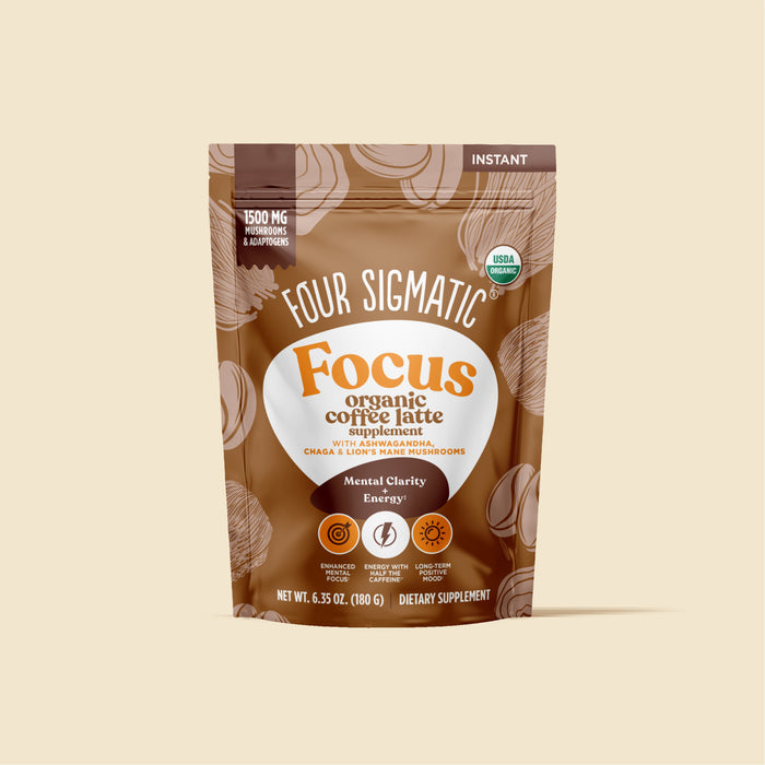 Four Sigmatic Focus organic coffee latte supplement package on a beige background.