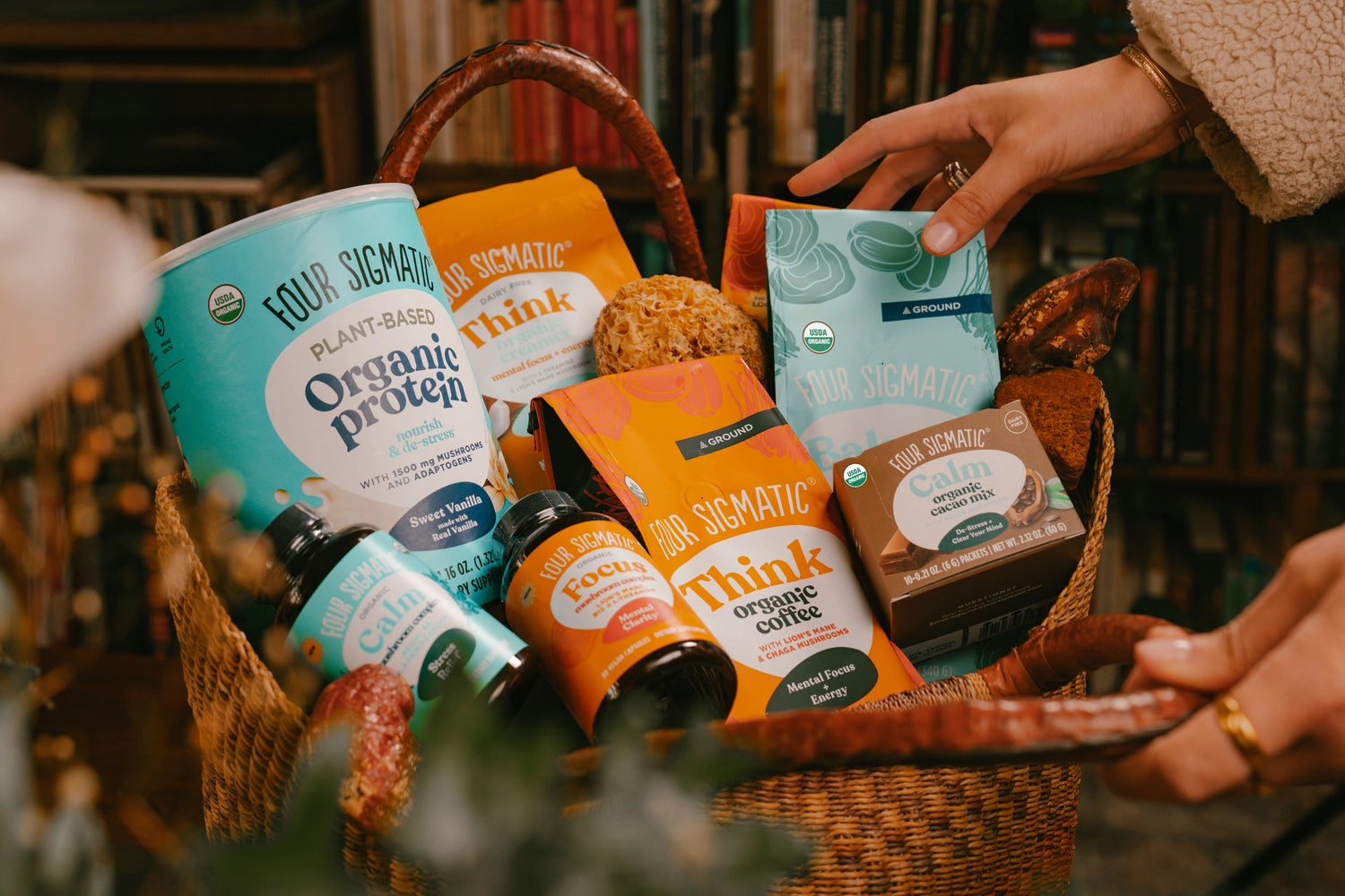 A basket filled with various Four Sigmatic health food products.