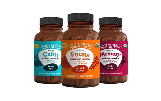 Three bottles of Four Sigmatic mushroom supplement capsules: Calm (stress relief), Focus (mental clarity), and Memory (brain health).